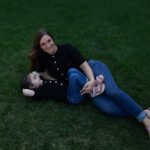 Mom and young daughter sharing a sweet moment during a spring lifestyle photo session.