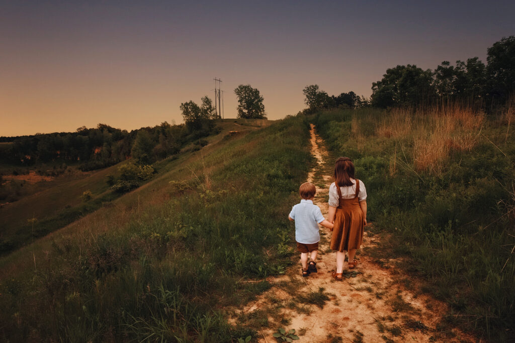 Children walking on a trail at sunset in Onalaska, Wisconsin – captured by Visual Creations Photography