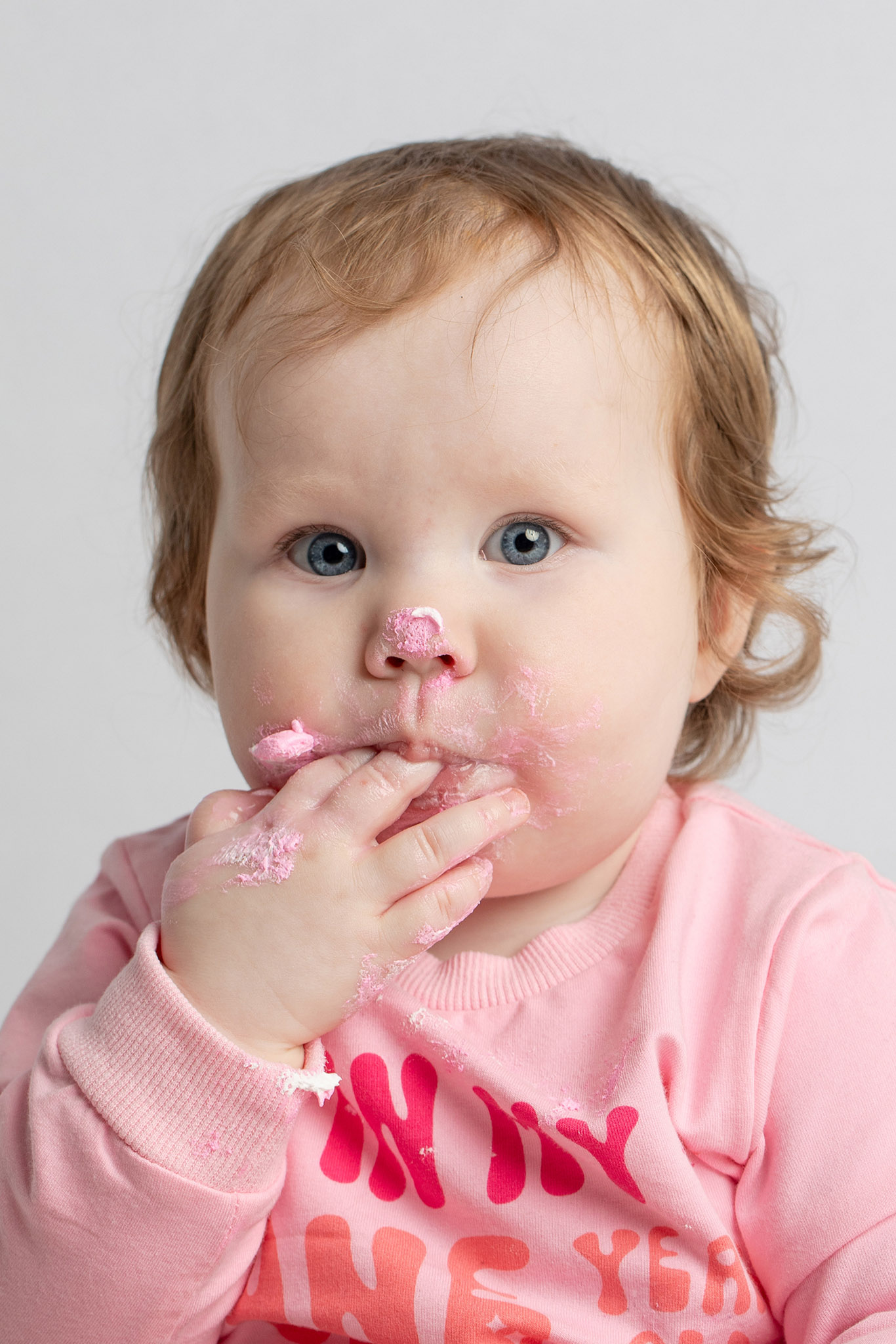 Baby cake smash photography detail captured in a Wisconsin studio