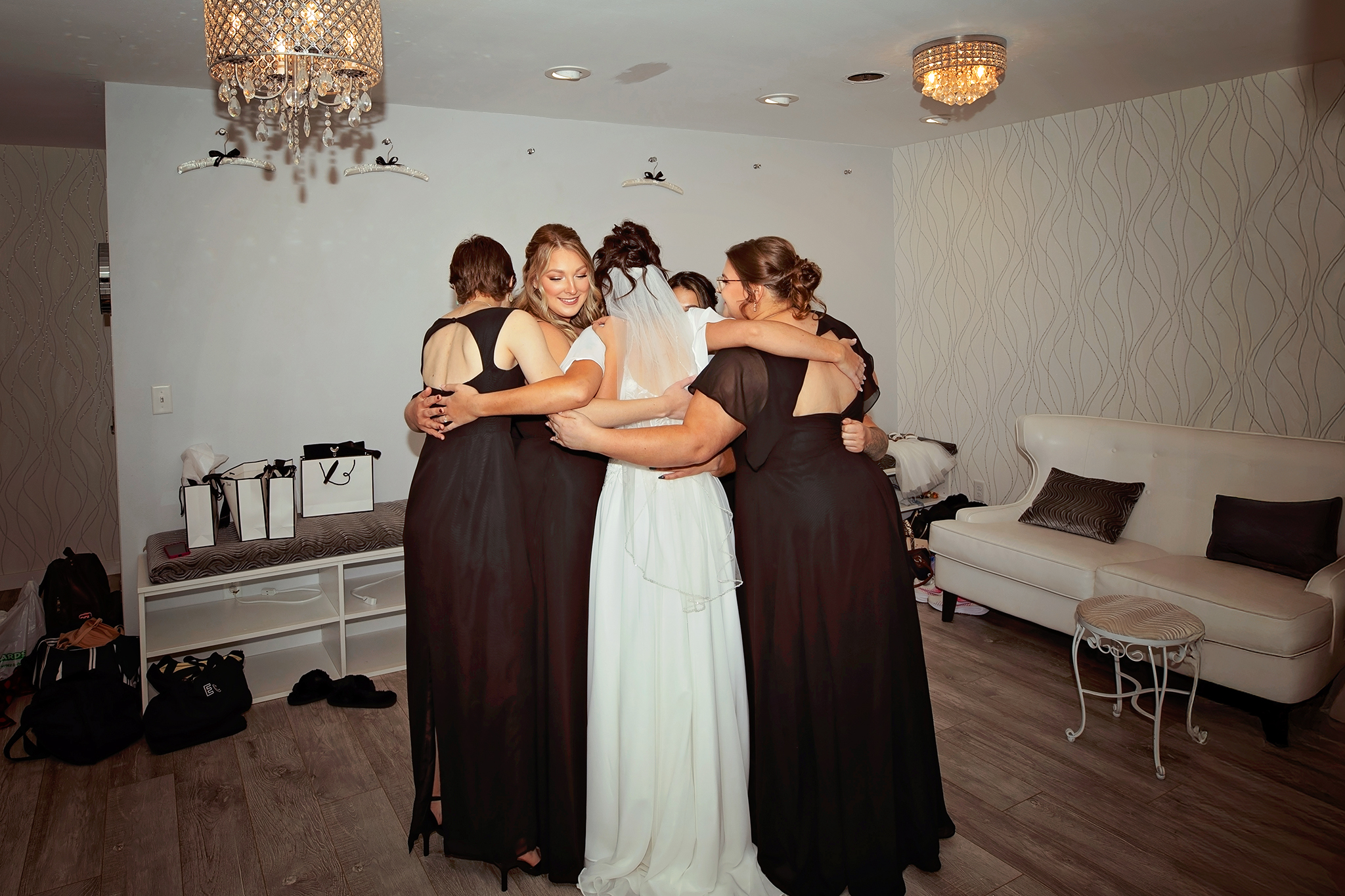 Natural light wedding photographer in Onalaska Wisconsin capturing an emotional documentary wedding moment indoors