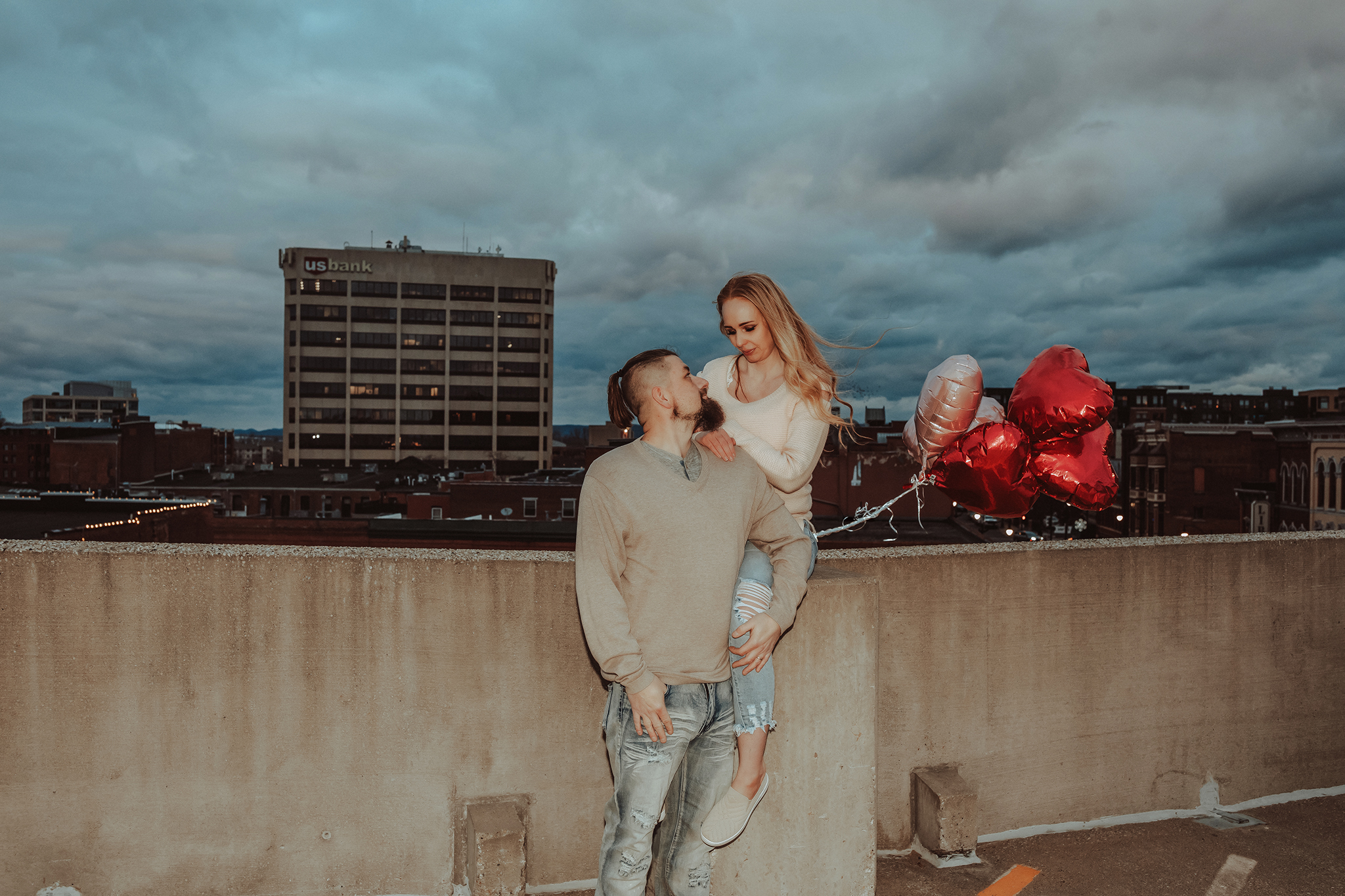 Candid engagement photos of couple walking in downtown La Crosse Wisconsin