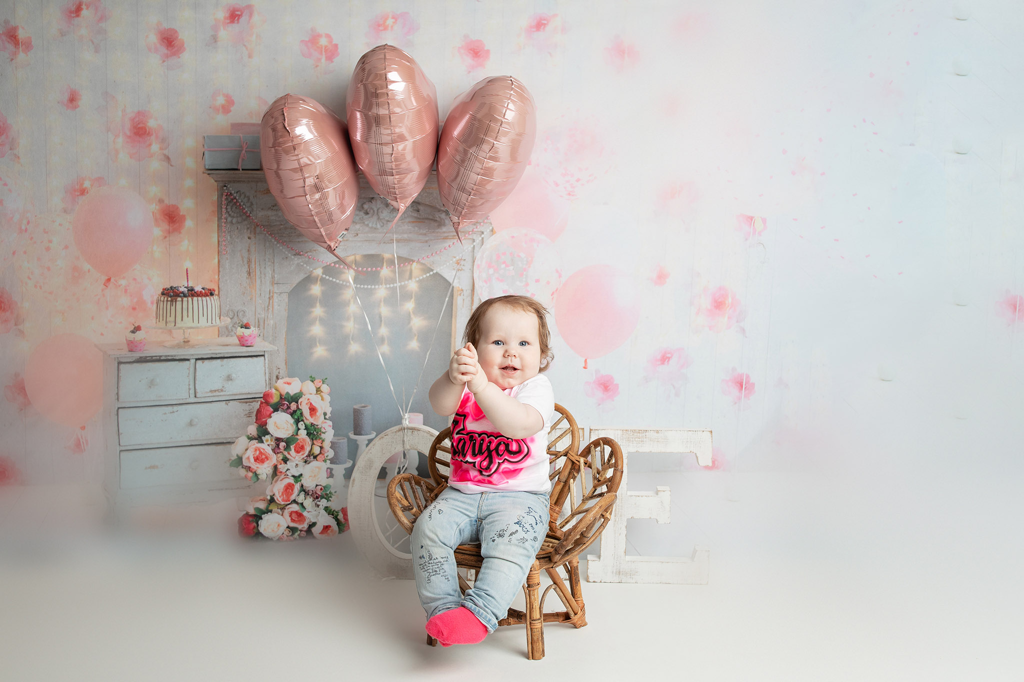 First birthday cake smash with balloons photographed near Onalaska Wisconsin