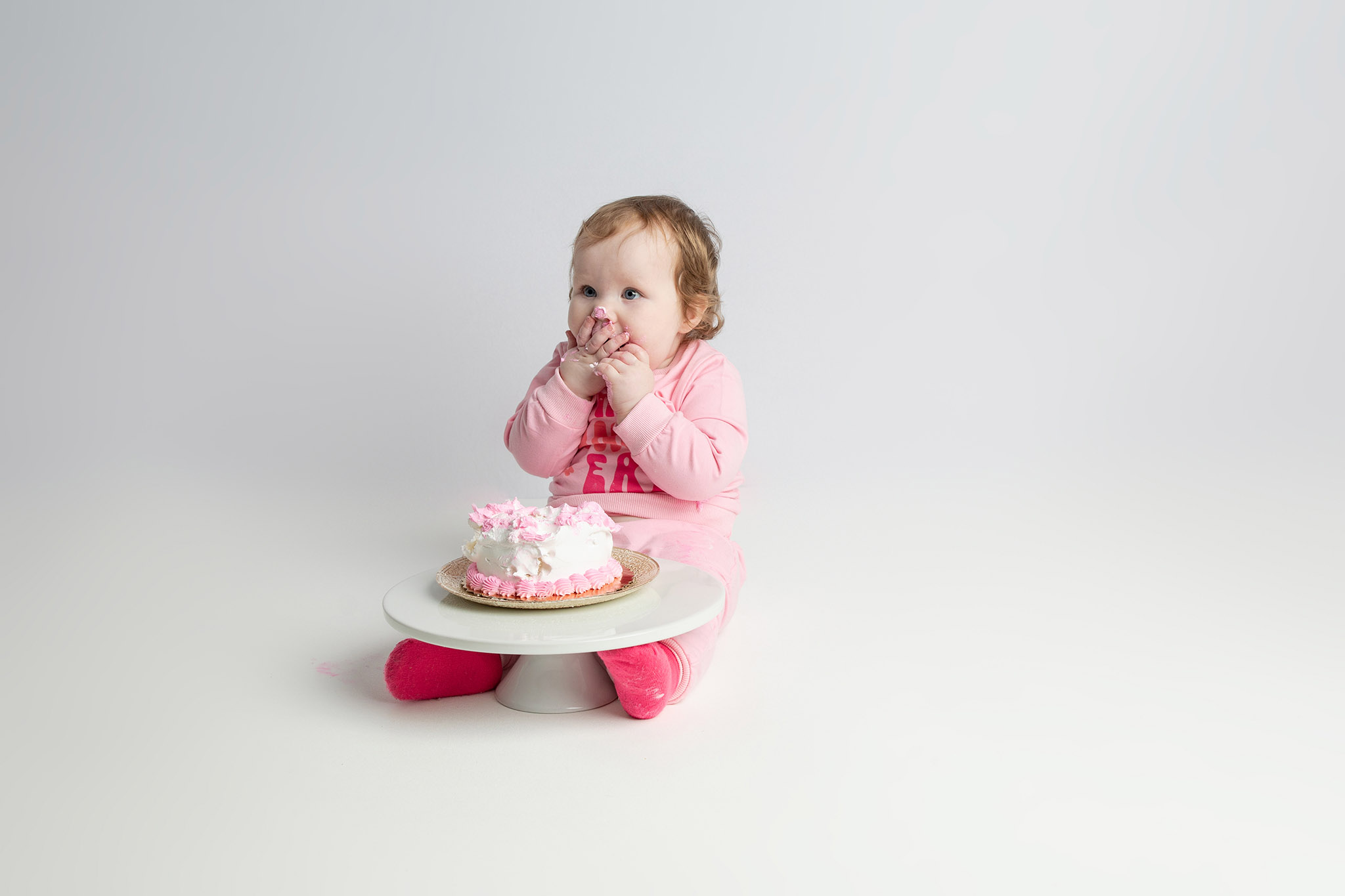 One year old cake smash session at Visual Creations Photography studio near Holmen Wisconsin