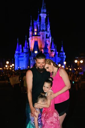 Jodee Wallin and her family at Magic Kingdom in front of Cinderella Castle